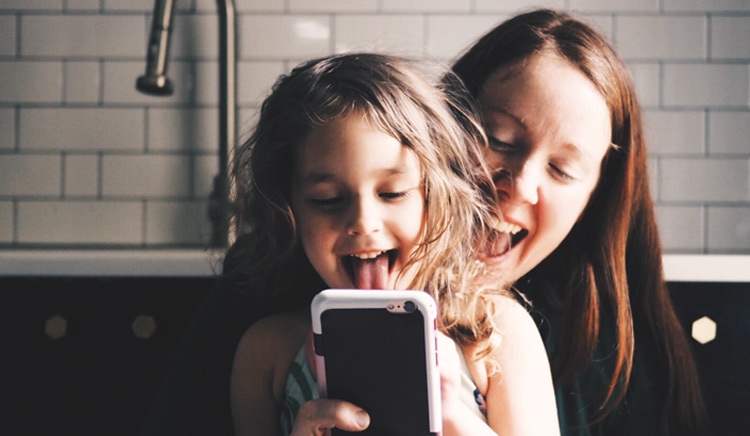 Mother and daughter smiling